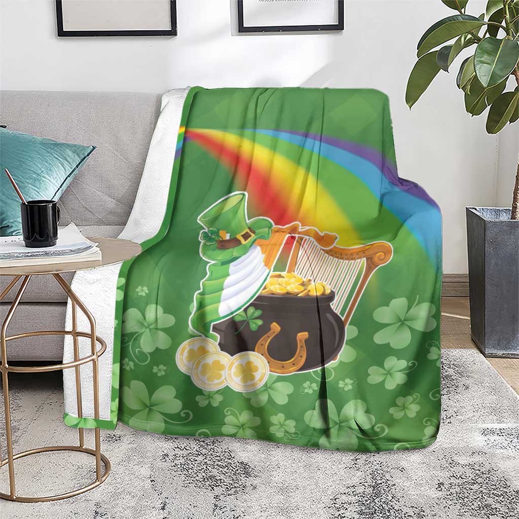 Green throw blanket over armchair with harp and pot of gold, rainbow stripe, clovers