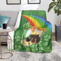 Green throw blanket over armchair with harp and pot of gold, rainbow stripe, clovers