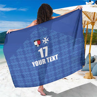 Blue football-style sarong with geometric pattern, soccer crest, number 17 and 'YOUR TEXT'.