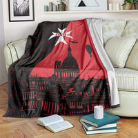 Red and black Malta-themed throw blanket with white star and city skyline print