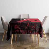 Red and black city-graphic tablecloth centered on dining table