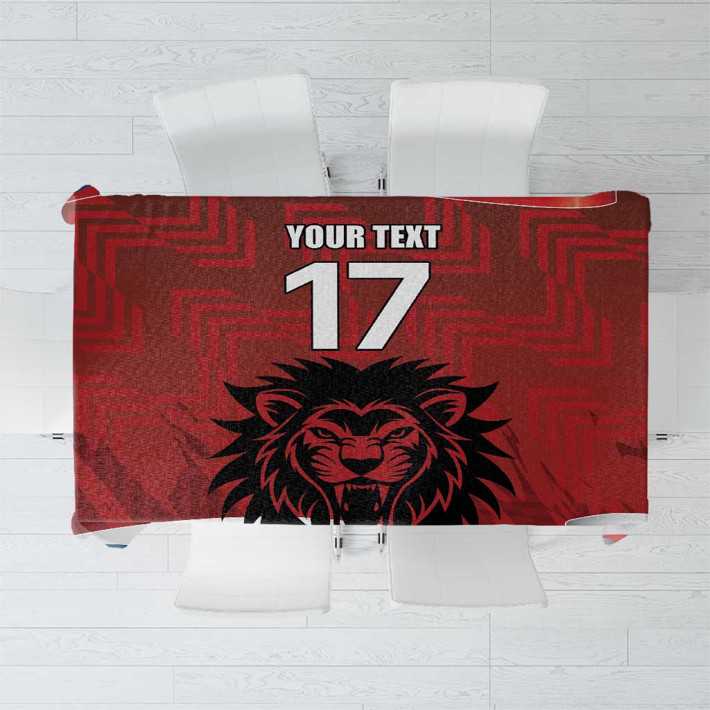 Red custom tablecloth with geometric pattern and lion face graphic, "17" and text panel