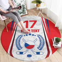 Round hockey-themed area rug with red border, blue crest, crossed sticks, puck, and '17'
