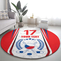 Round hockey-themed area rug with red edges, white center, blue crest, and crossed sticks
