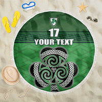 Green round beach blanket with white fringe, Celtic knot shamrock and number 17