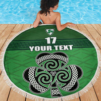 Green round beach blanket with white fringe, Celtic knot shamrock design and “YOUR TEXT”
