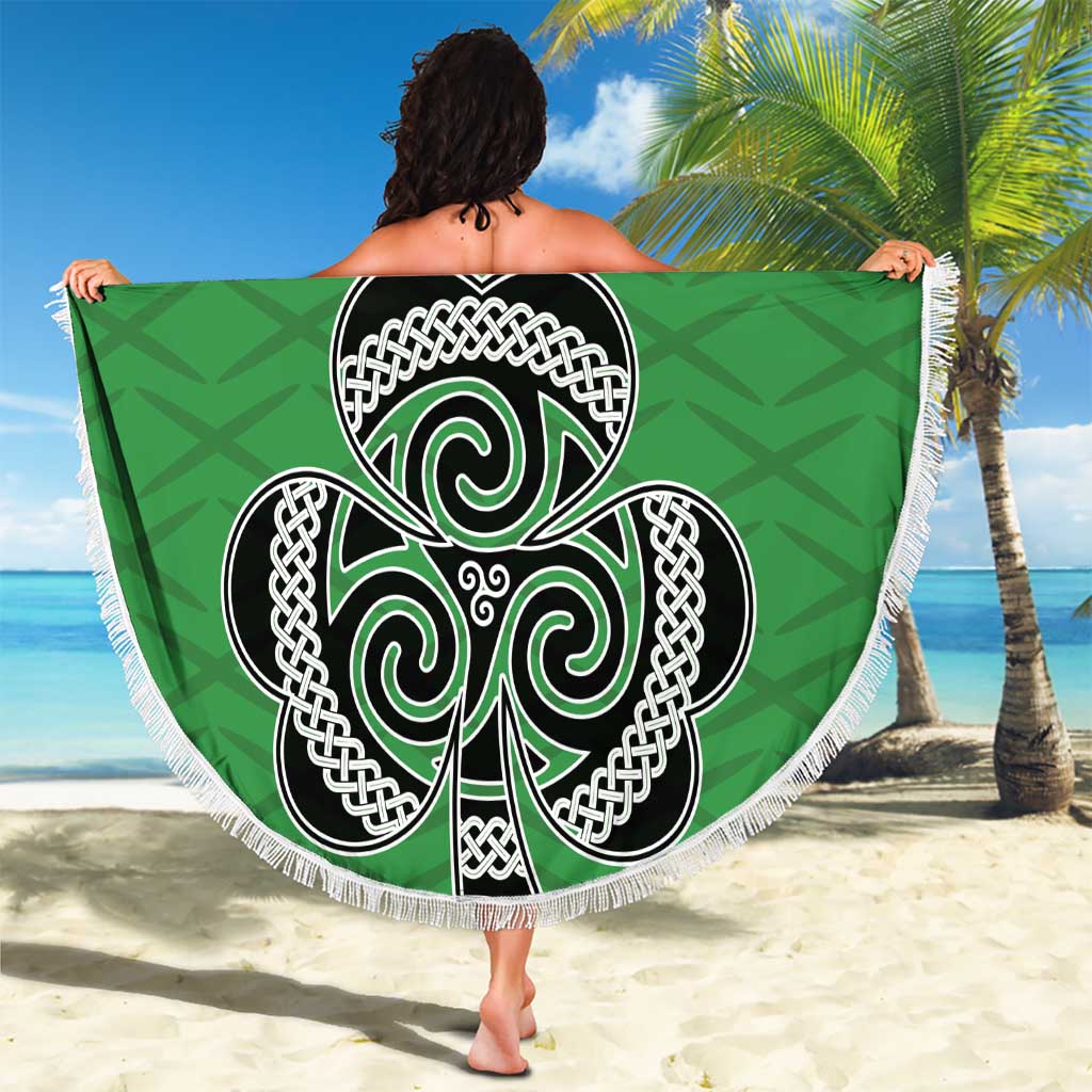 Green round beach blanket with white fringe, Celtic knot shamrock emblem and number 17