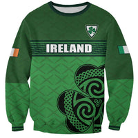 Green unisex football sweatshirt with front crest, shamrock, and Celtic knot print