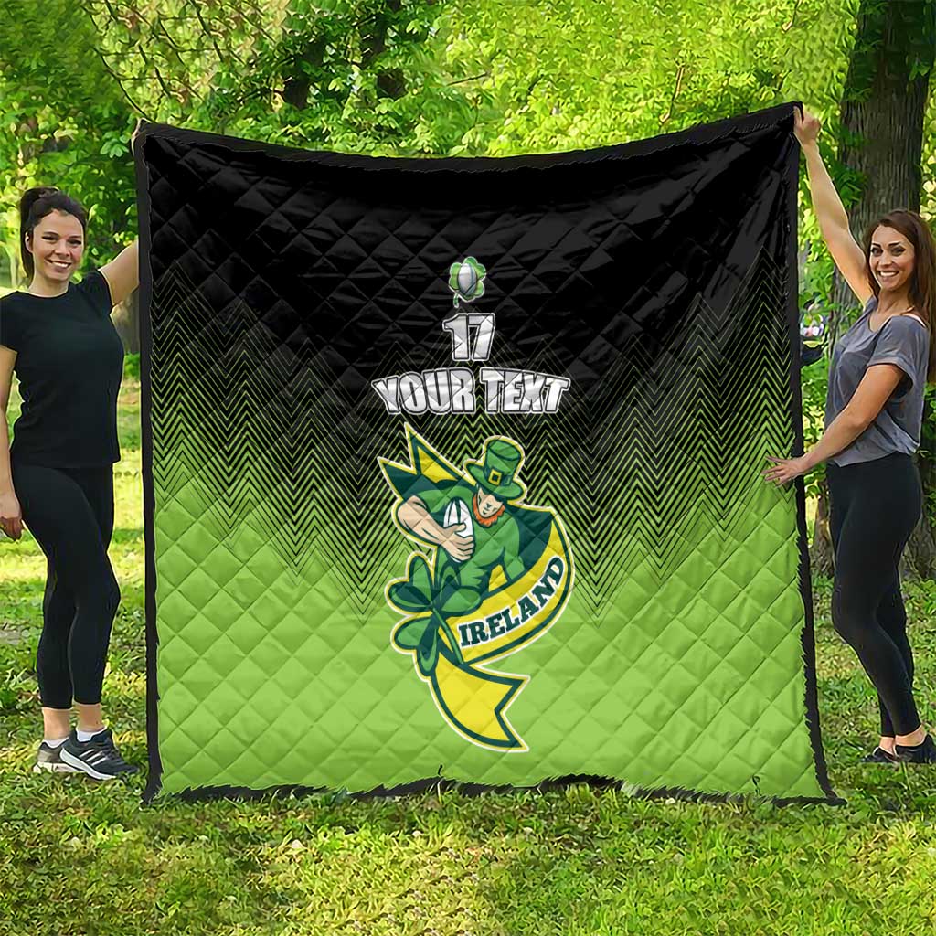 Green and black quilt blanket with chevron pattern and Ireland shamrock mascot graphic