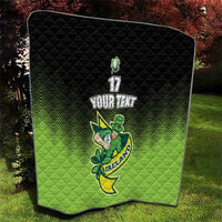Green and black quilt blanket with chevron zigzag and Ireland shamrock emblem