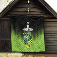 Green and black quilt blanket hanging on porch with Ireland shamrock mascot and number 17