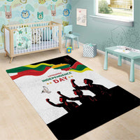 Playroom area rug with white base, Lithuania Independence Day text, and black dancer silhouettes