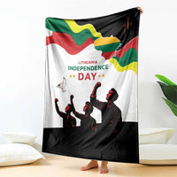 Independence Day blanket draped on floor, Lithuania flag graphic and black soldier silhouettes
