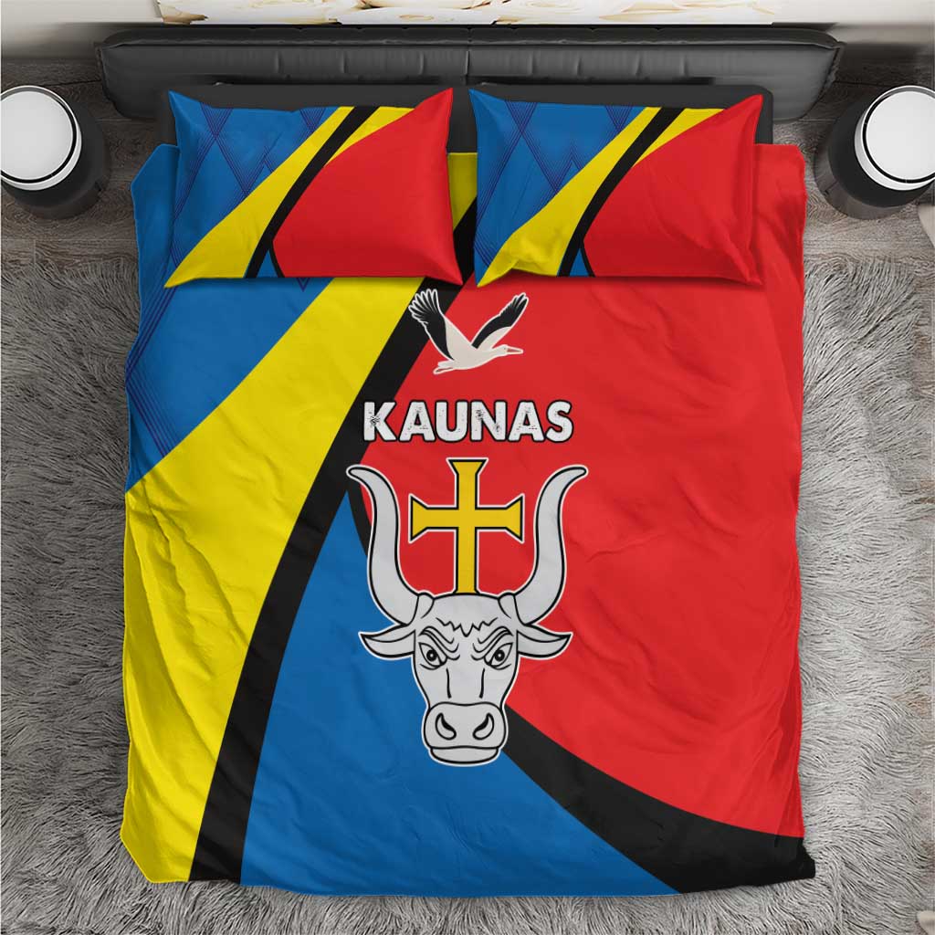 Bedding set on gray rug: blue, red, and yellow flag design with Kaunas crest and dove on quilt