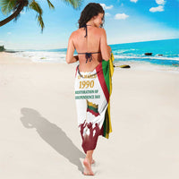 Wrap sarong with Independence Day 1990 text and flag-striped pattern, back view