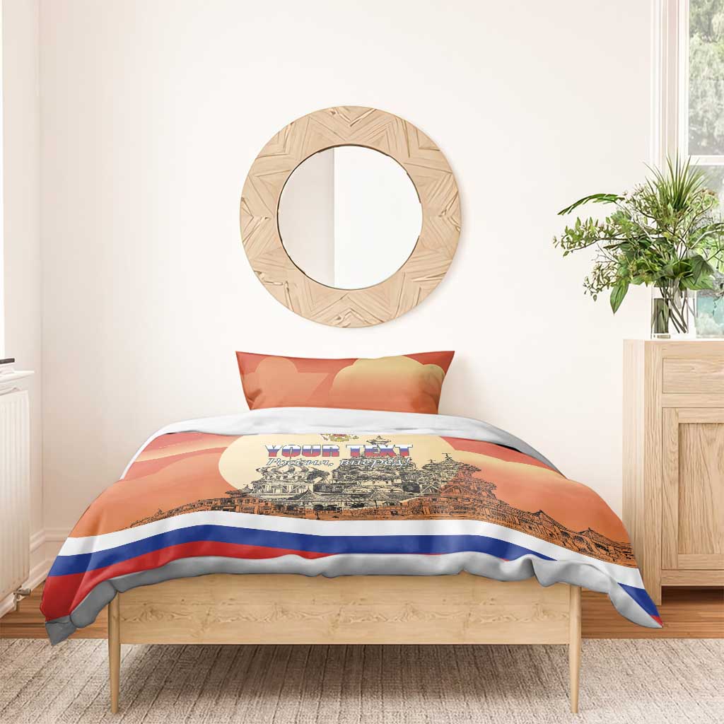 Personalized red duvet cover on bed with one pillow, city skyline print and blue stripe