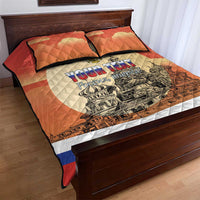 Red quilt bed set with orange pillows; white panel with Russian text and cityscape graphics