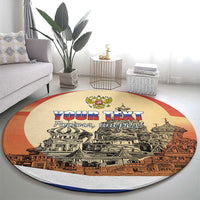 Round carpet with red border, beige center, city illustration and 'YOUR TEXT' text