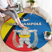 Round multicolor carpet rug with large text and statue graphic in center