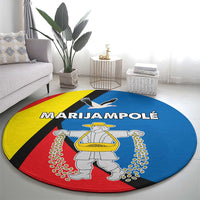Round multicolor carpet rug with central statue figure and sweeping banner text