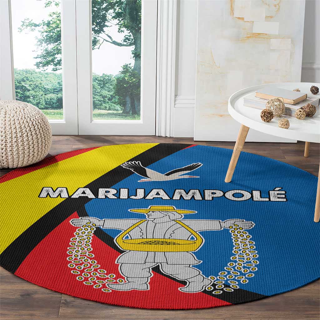 Round multicolor carpet rug showing statue illustration and bold banner lettering
