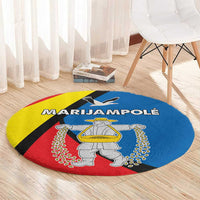Round multicolor carpet rug with central statue graphic and thick red, yellow, blue bands