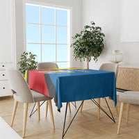 Tablecloth draped on dining table with red, blue, and yellow diagonal design.