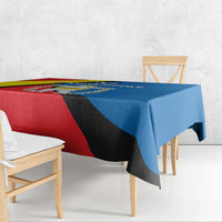 Rectangular tablecloth with red, blue, and yellow diagonal pattern and emblem.
