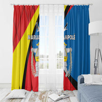 Window curtain pair on rod with red and blue print panels and crest details