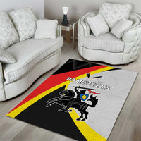 Black area rug with red and yellow diagonal stripes and heraldic lion graphic