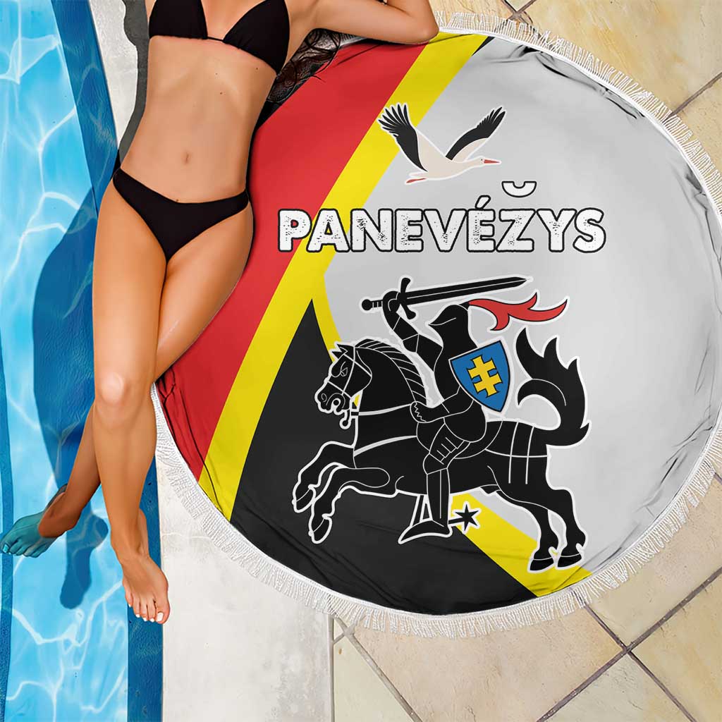 Round beach blanket with fringed edge, white fabric with red/yellow/black emblem artwork