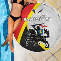 Round beach blanket with fringed edge, white fabric with red/yellow/black emblem artwork