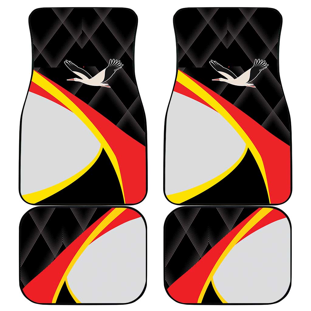Set of black car floor mats with red-yellow stripe and white bird emblem design