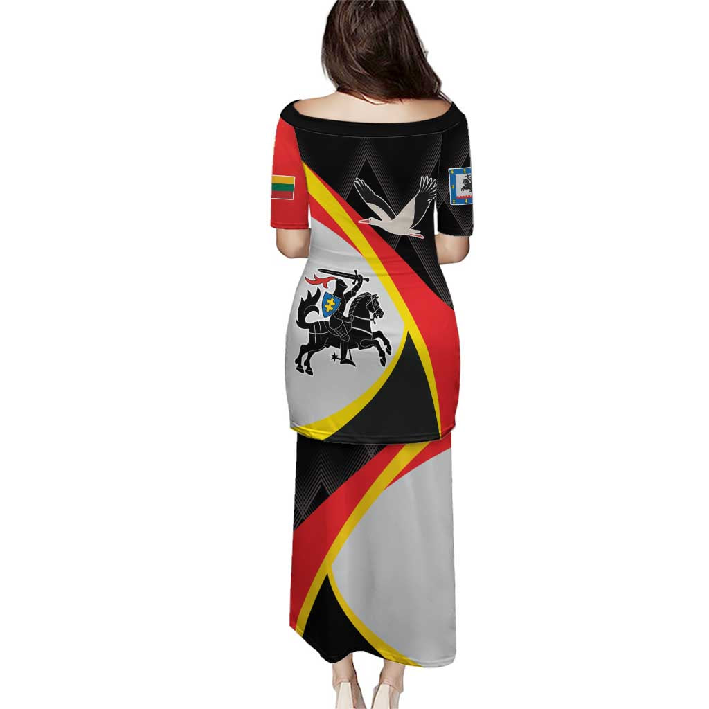 Back view of long black off-shoulder dress with red and yellow diagonal graphic panels