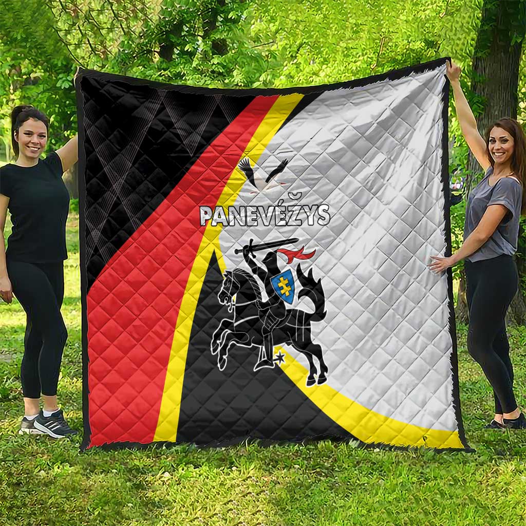 Black, red and white quilt with crest and diagonal panels, quilted stitched design.
