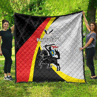 Black, red and white quilt with crest and diagonal panels, quilted stitched design.