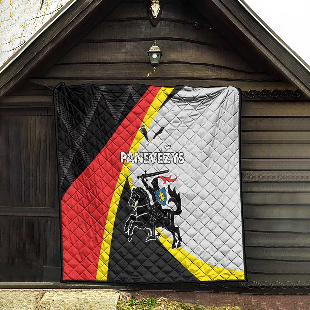 Panevezys quilt blanket with black, red, white, and yellow panels and crest