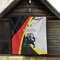 Panevezys quilt blanket with black, red, white, and yellow panels and crest