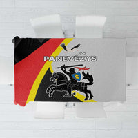 Black tablecloth with red and yellow diagonal stripes and coat-of-arms graphic