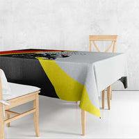 Black tablecloth with red and yellow diagonal stripe pattern on a table