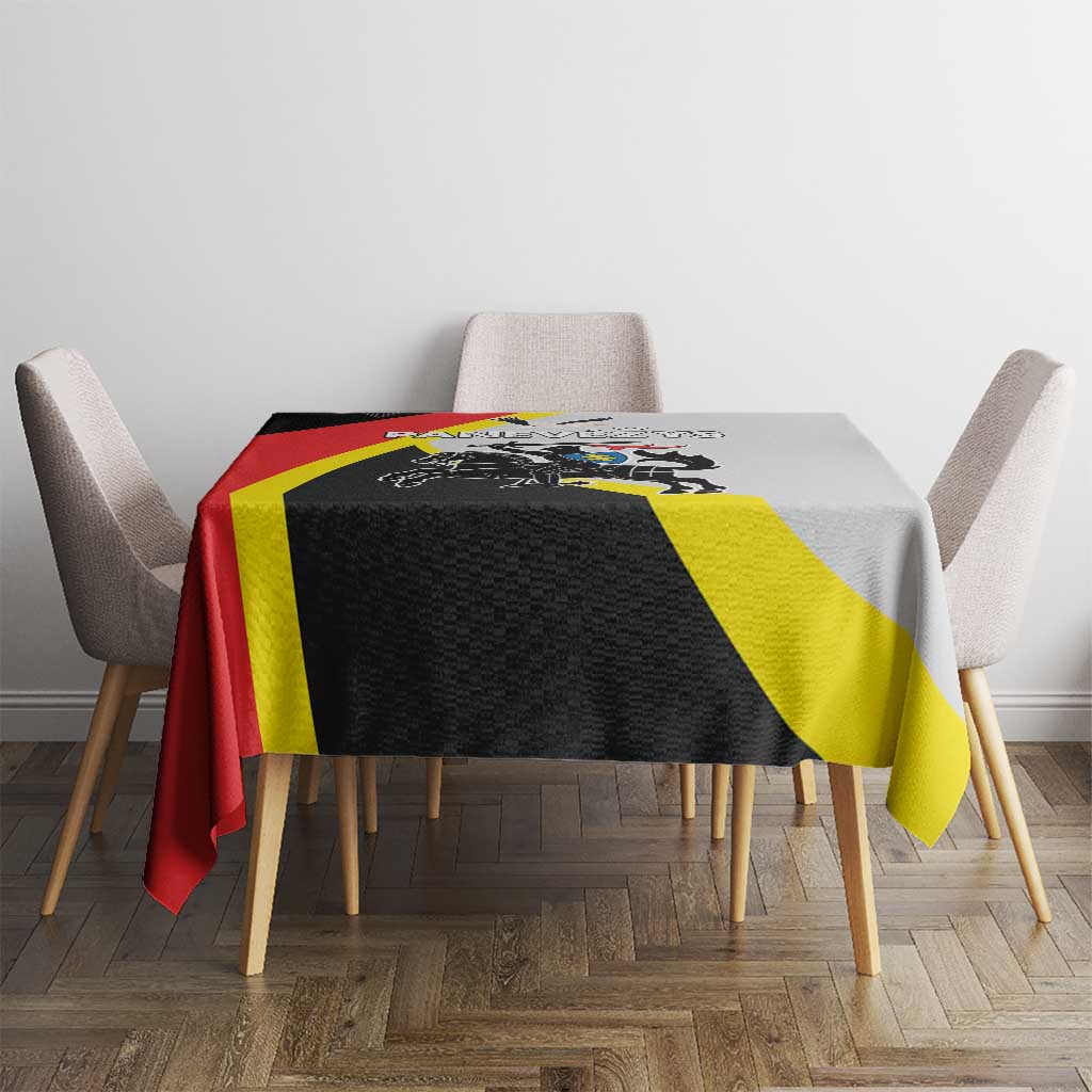 Black tablecloth with red, yellow diagonal stripes and crest graphic on table