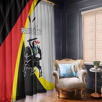 Black and light gray window curtain panels with crest graphic and red-yellow diagonal stripe