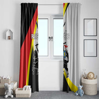 Black and light gray window curtain panels hanging on a doorway with crest and stripe design