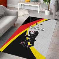 Black area rug with red and yellow diagonal stripes and centered cartoon animal crest logo