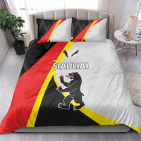 Bedding set on bed: duvet cover and two pillows with black red yellow flag design