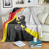 Black, red, and yellow Siauliai county flag blanket with a running cartoon animal graphic