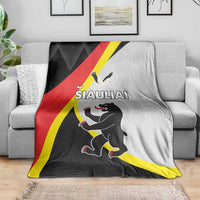 Siauliai-themed throw blanket in black, red, and yellow with running cartoon animal
