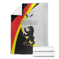 Folded Siauliai county flag blanket in black, red, yellow, and white with animal graphic