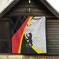 Quilt hanging on an exterior wall with black, red, white and yellow SIAULIAI design