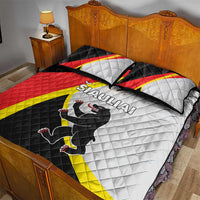 Quilt bed set featuring Siauliai text and black animal on white quilt, red-yellow-black stripes